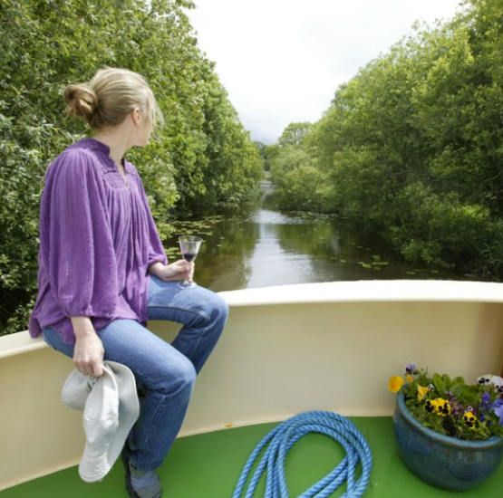 Woman drinking glass of wine aboard Shannon Princess